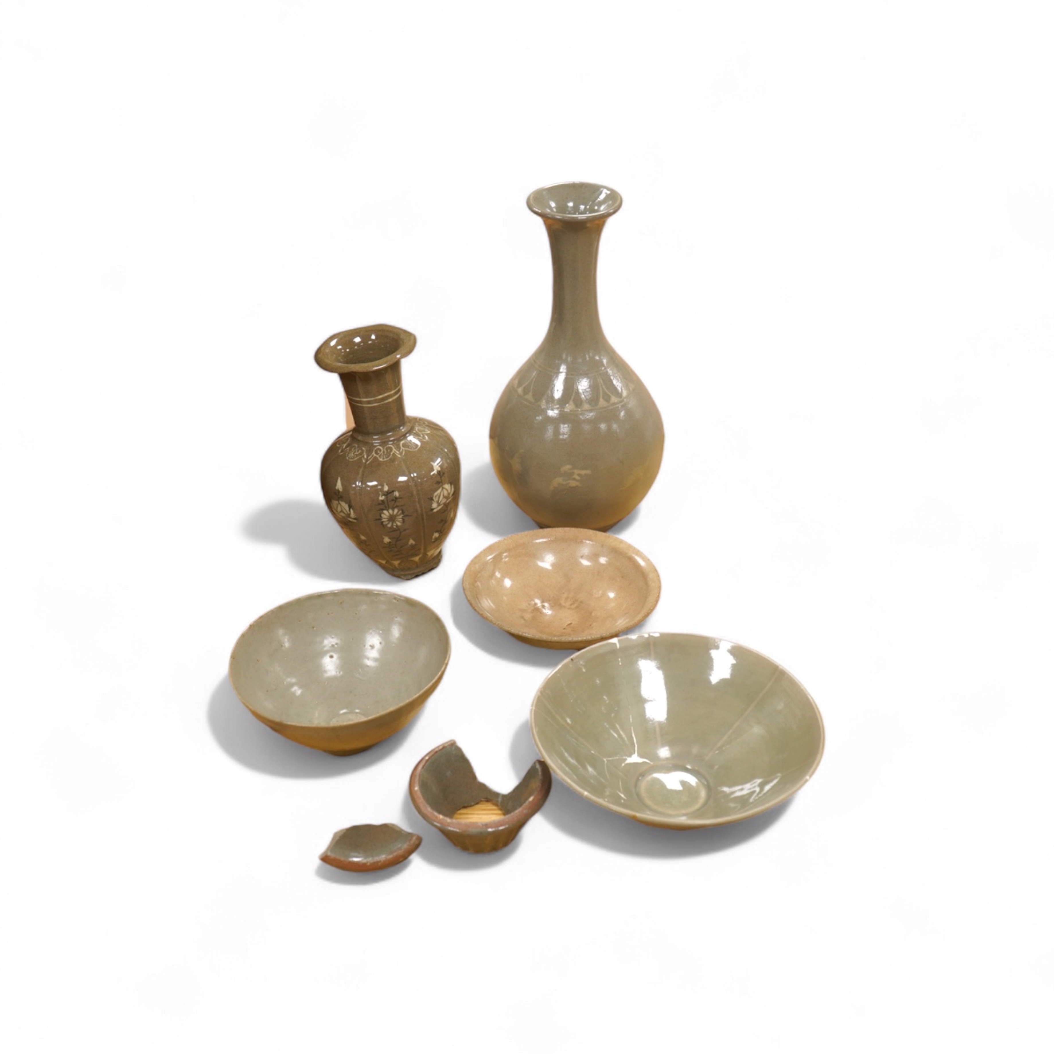 Five pieces of Chinese/Korean celadon comprising three bowls and two vases, 31cm high. Condition - some breaks